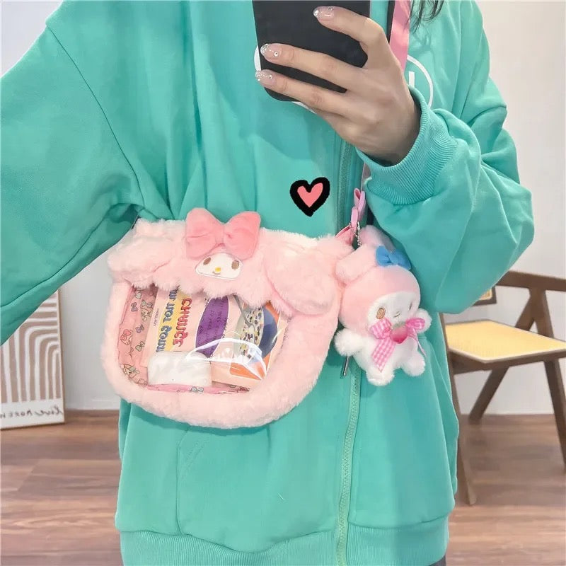 Cartera + Llavero “Sanrio”. 22x16x5Cms