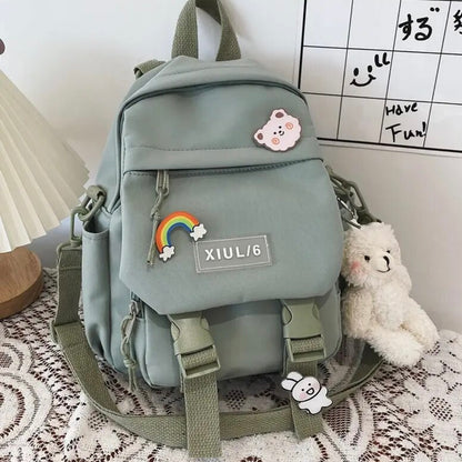 Mini Mochila Impermeable + 3 Pins + Llavero. 27x23x13Cms