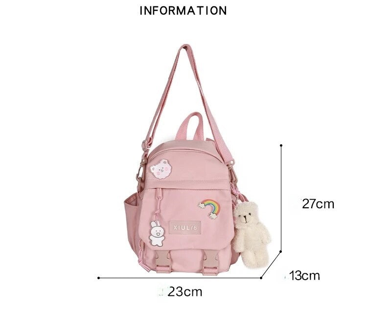 Mini Mochila Impermeable + 3 Pins + Llavero. 27x23x13Cms